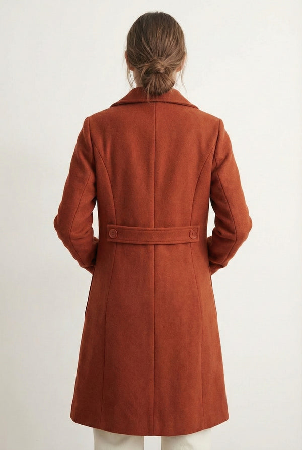 Sienna rust Mercer Coat by LOHNR, a tailored faux wool trench coat featuring structured lapels, deep utility pockets, and a refined quiet luxury aesthetic.