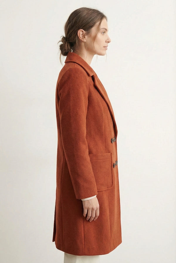 Sienna rust Mercer Coat by LOHNR, a tailored faux wool trench coat featuring structured lapels, deep utility pockets, and a refined quiet luxury aesthetic.