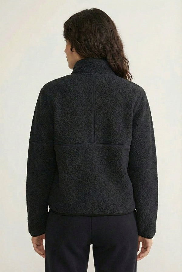 Women's Roam Sherpa Fleece Pullover in Onyx by LOHNR. A plush, half-zip layering piece with a structured collar.