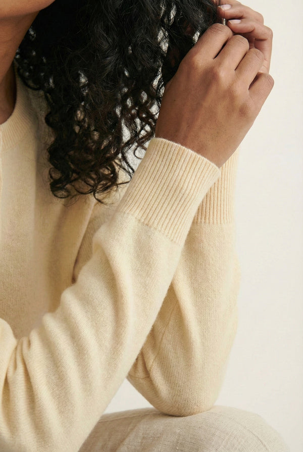 Women's smooth Roux Henley Sweater in Almond by LOHNR, featuring a relaxed blouson fit, dropped shoulders, and a half-button placket.