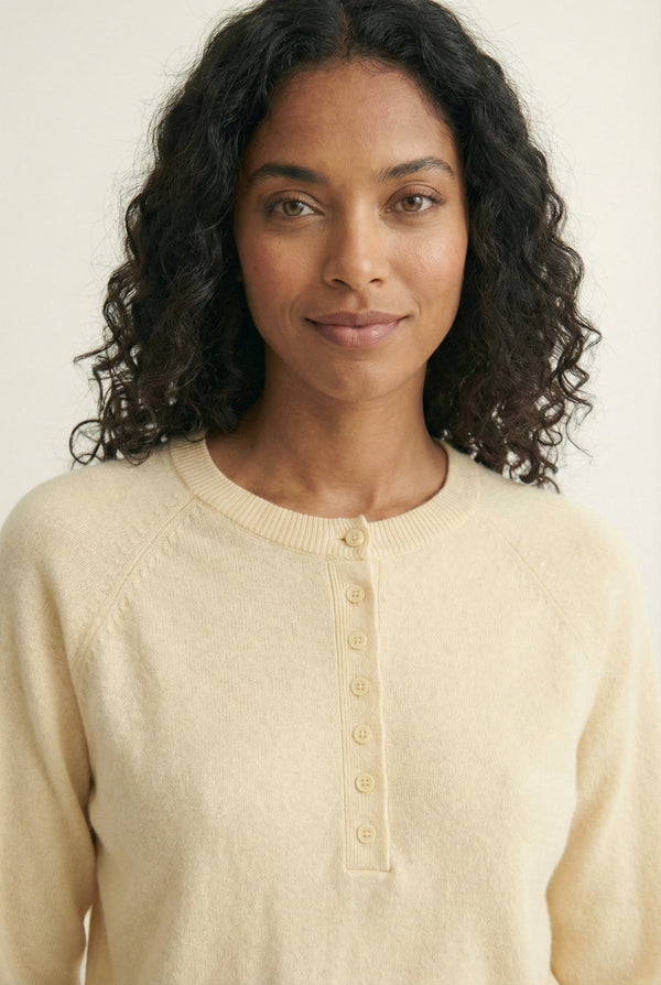 Women's smooth Roux Henley Sweater in Almond by LOHNR, featuring a relaxed blouson fit, dropped shoulders, and a half-button placket.