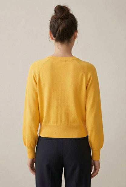 Women's smooth Roux Henley Sweater in Butter by LOHNR, featuring a relaxed blouson fit, dropped shoulders, and a half-button placket.