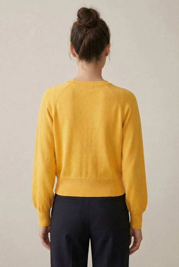 Women's smooth Roux Henley Sweater in Butter by LOHNR, featuring a relaxed blouson fit, dropped shoulders, and a half-button placket.