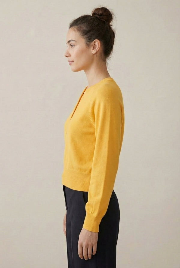 Women's smooth Roux Henley Sweater in Butter by LOHNR, featuring a relaxed blouson fit, dropped shoulders, and a half-button placket.