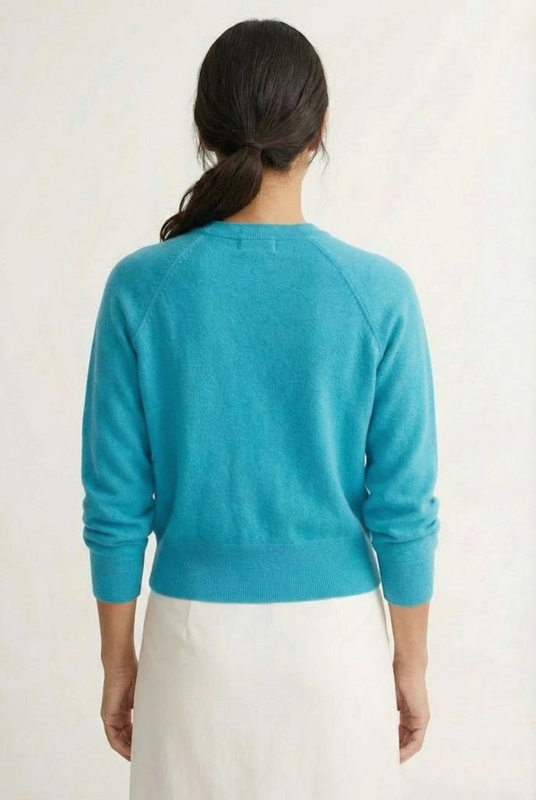 Women's smooth Roux Henley Sweater in Cerulean by LOHNR, featuring a relaxed blouson fit, dropped shoulders, and a half-button placket.