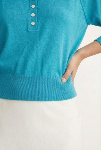 Women's smooth Roux Henley Sweater in Cerulean by LOHNR, featuring a relaxed blouson fit, dropped shoulders, and a half-button placket.
