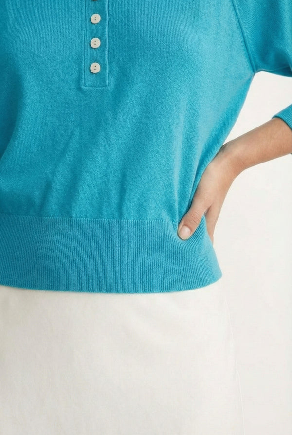 Women's smooth Roux Henley Sweater in Cerulean by LOHNR, featuring a relaxed blouson fit, dropped shoulders, and a half-button placket.