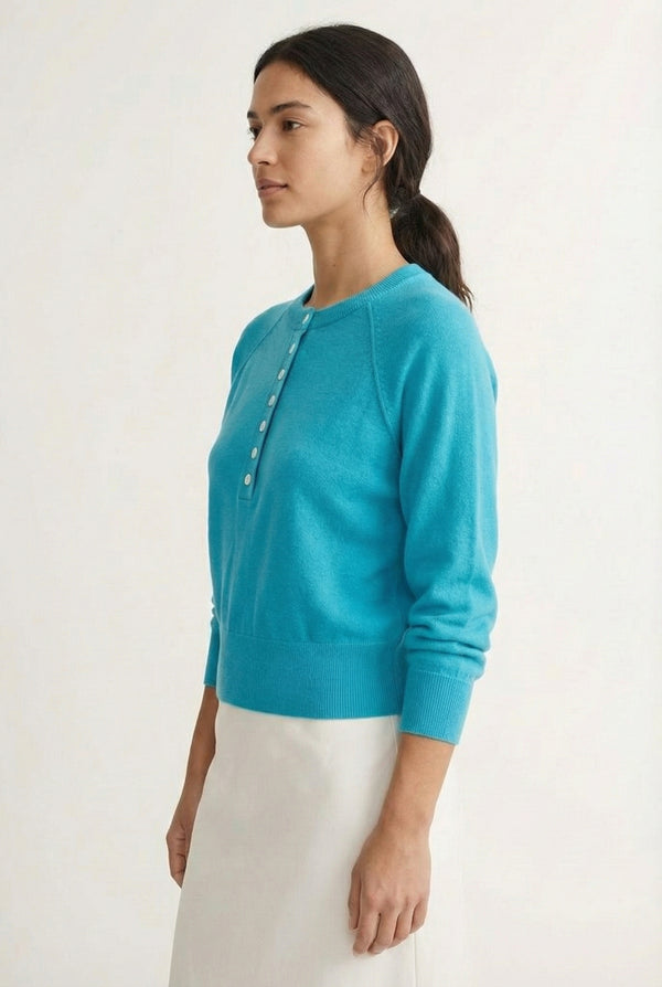 Women's smooth Roux Henley Sweater in Cerulean by LOHNR, featuring a relaxed blouson fit, dropped shoulders, and a half-button placket.