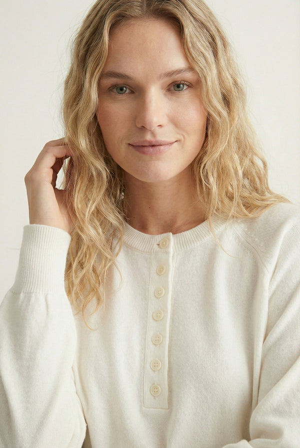 Women's smooth Roux Henley Sweater in Ecru by LOHNR, featuring a relaxed blouson fit, dropped shoulders, and a half-button placket.