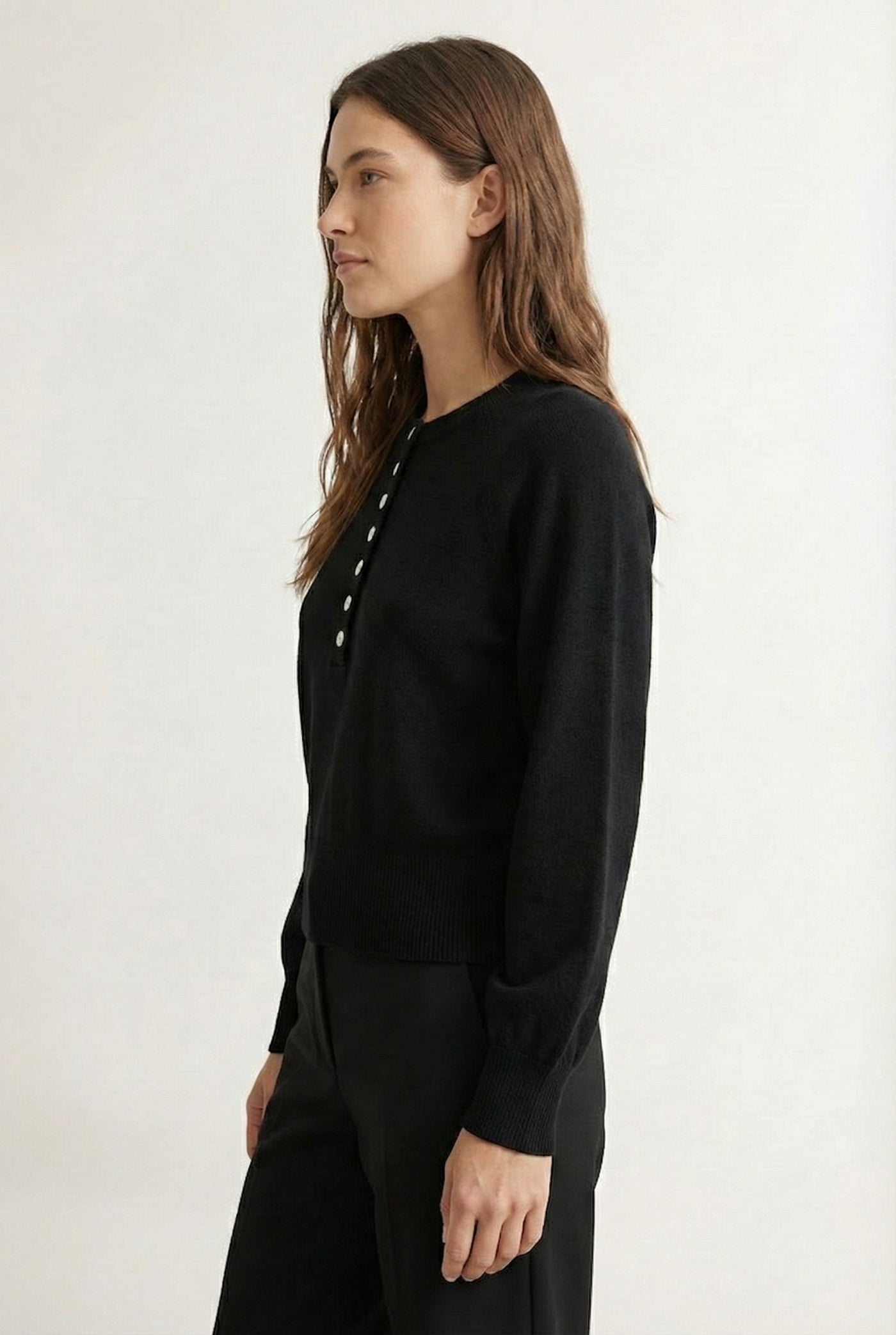 Women's smooth Roux Henley Sweater in Onyx by LOHNR, featuring a relaxed blouson fit, dropped shoulders, and a half-button placket.