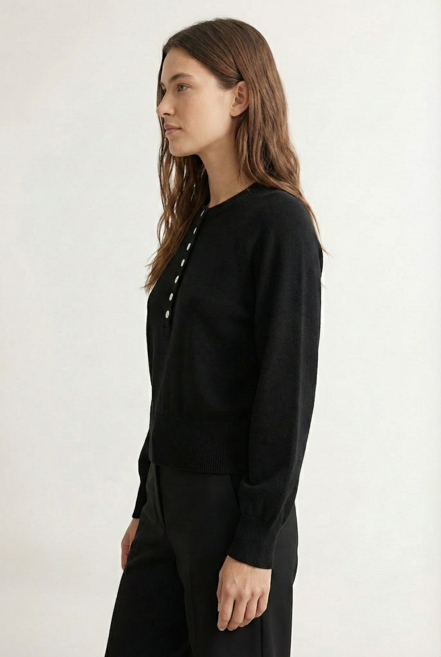 Women's smooth Roux Henley Sweater in Onyx by LOHNR, featuring a relaxed blouson fit, dropped shoulders, and a half-button placket.