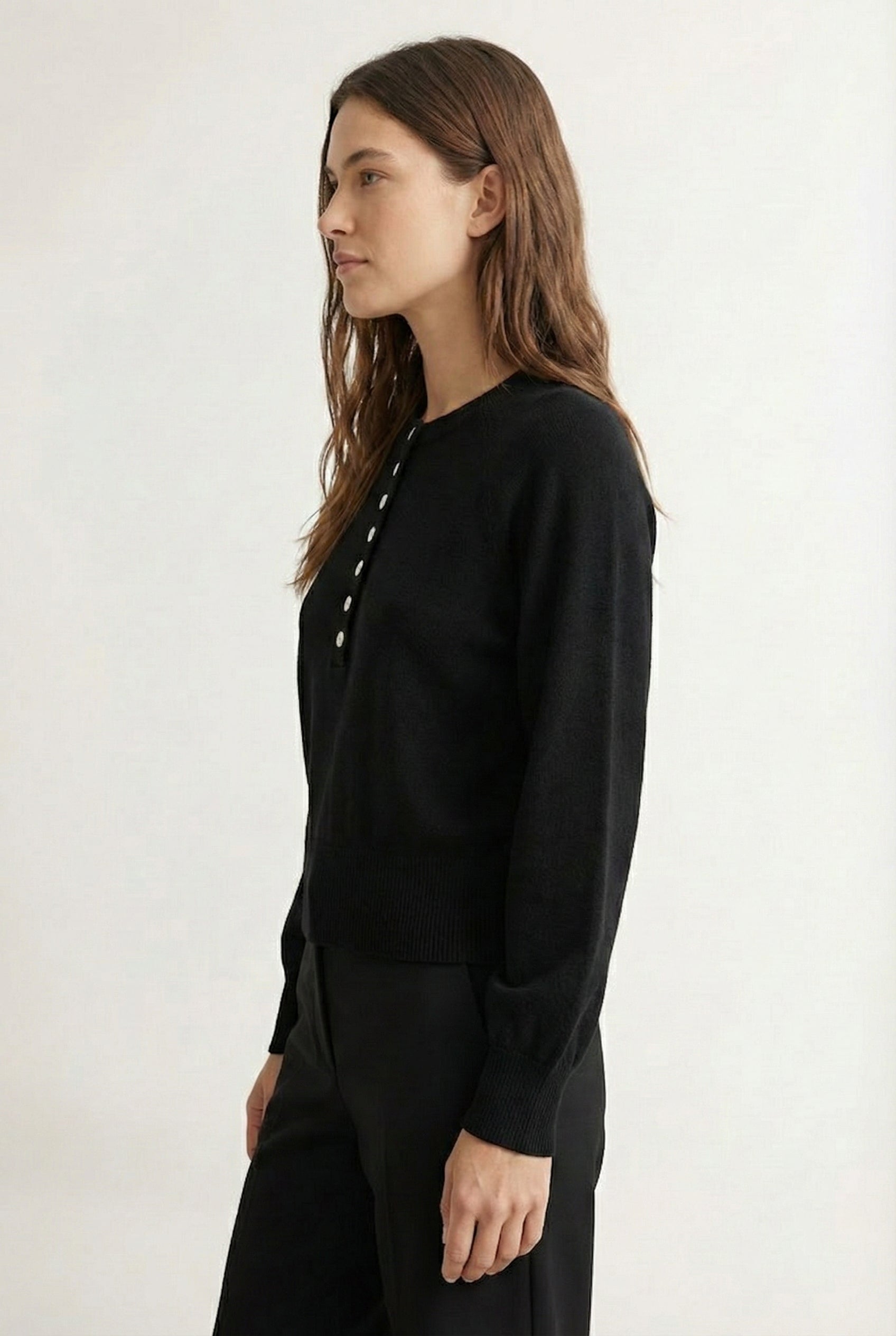 Women's smooth Roux Henley Sweater in Onyx by LOHNR, featuring a relaxed blouson fit, dropped shoulders, and a half-button placket.