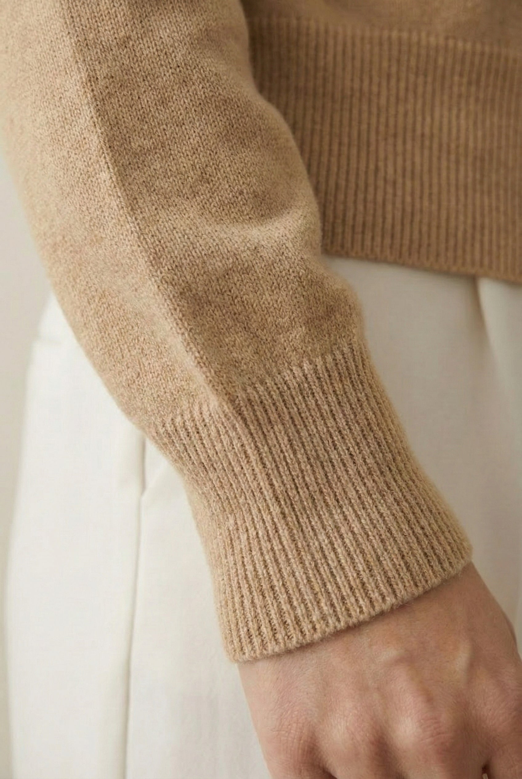 Women's smooth Roux Henley Sweater in Sandstone by LOHNR, featuring a relaxed blouson fit, dropped shoulders, and a half-button placket.