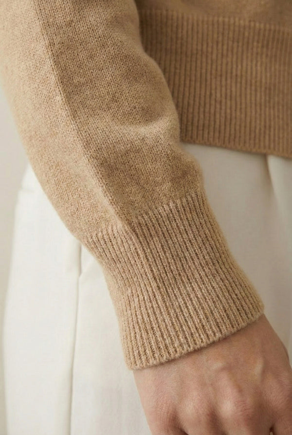 Women's smooth Roux Henley Sweater in Sandstone by LOHNR, featuring a relaxed blouson fit, dropped shoulders, and a half-button placket.