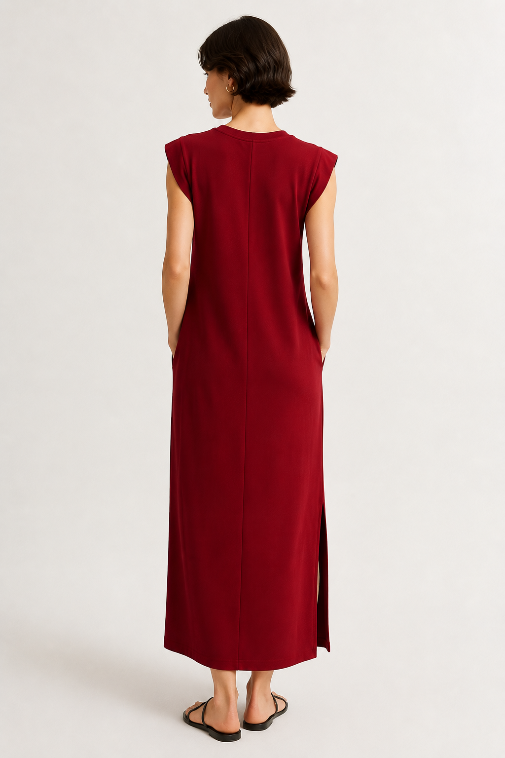 Professional studio shot of a model wearing the Lohnr Rowan Midi dress in Cabernet, featuring a premium relaxed drape and side split hem.