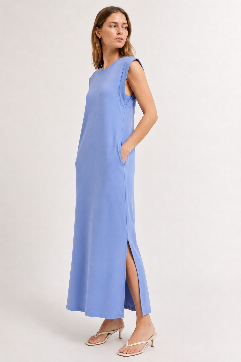 Professional studio shot of a model wearing the Lohnr Rowan Midi dress in Chambray, featuring a premium relaxed drape and side split hem.