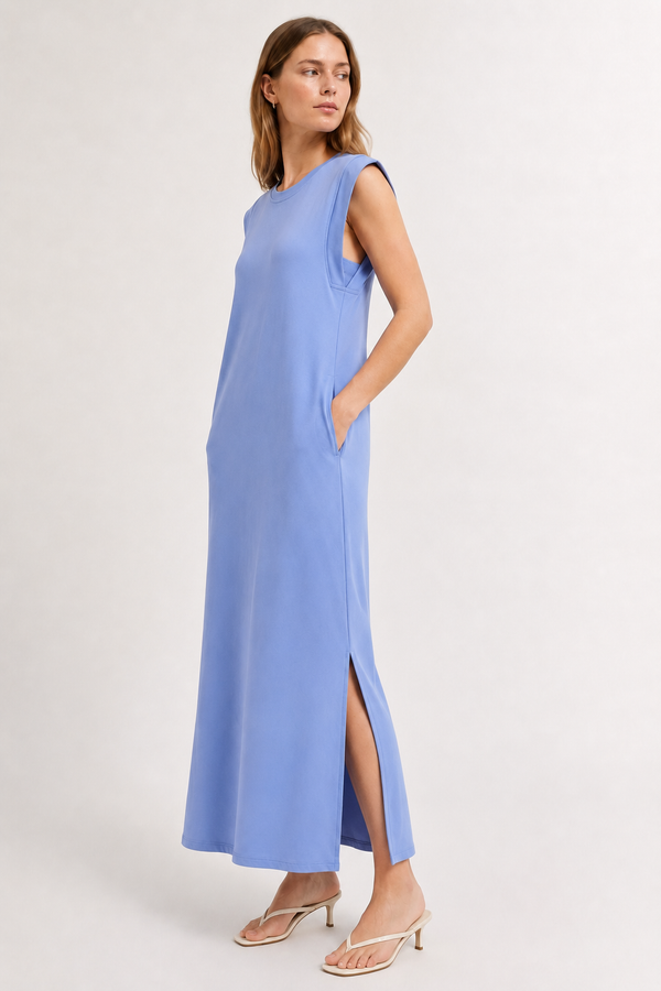 Professional studio shot of a model wearing the Lohnr Rowan Midi dress in Chambray, featuring a premium relaxed drape and side split hem.