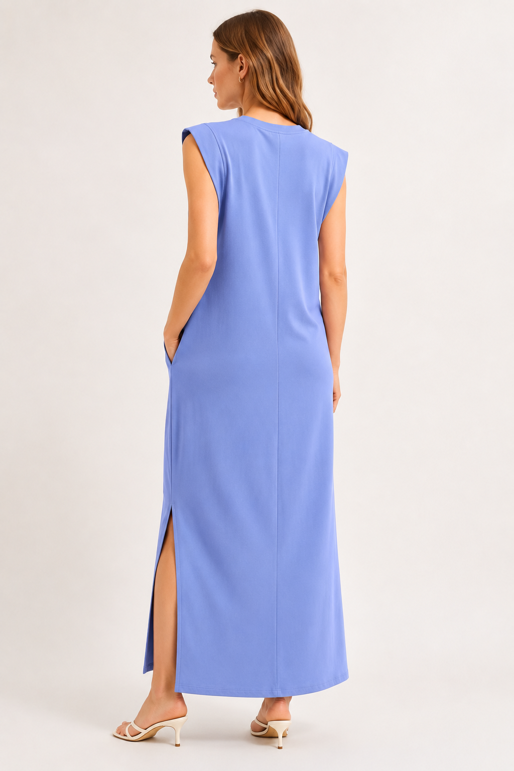 Professional studio shot of a model wearing the Lohnr Rowan Midi dress in Chambray, featuring a premium relaxed drape and side split hem.