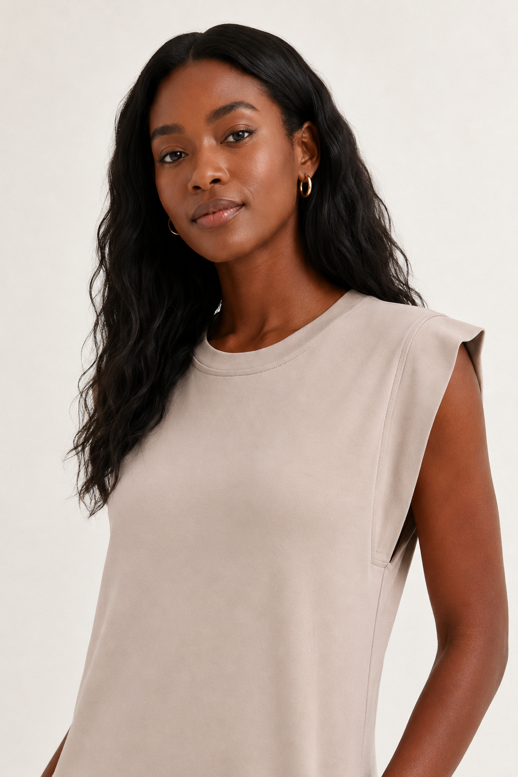 Professional studio shot of a model wearing the Lohnr Rowan Midi dress in Dune, featuring a premium relaxed drape and side split hem.
