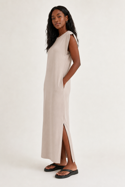 Professional studio shot of a model wearing the Lohnr Rowan Midi dress in Dune, featuring a premium relaxed drape and side split hem.