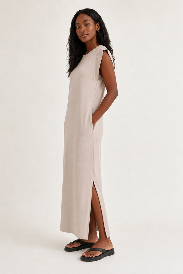 Professional studio shot of a model wearing the Lohnr Rowan Midi dress in Dune, featuring a premium relaxed drape and side split hem.
