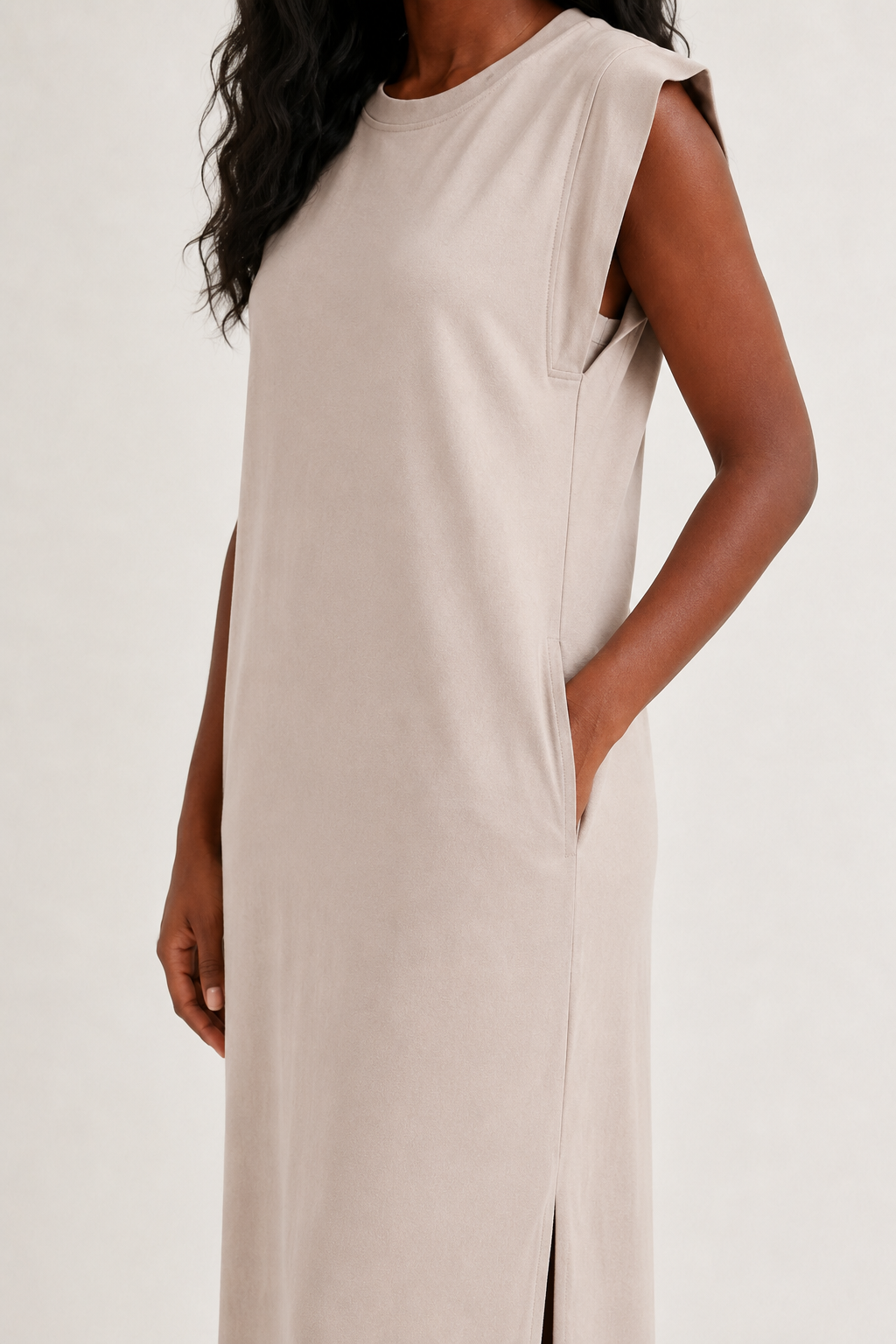 Professional studio shot of a model wearing the Lohnr Rowan Midi dress in Dune, featuring a premium relaxed drape and side split hem.