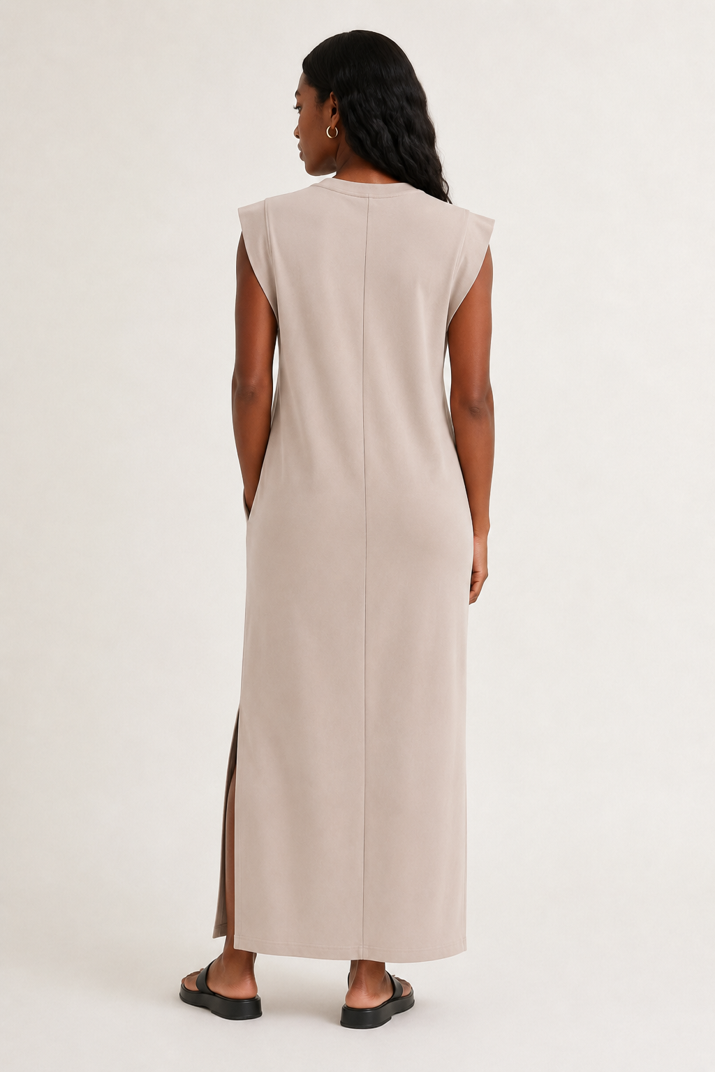 Professional studio shot of a model wearing the Lohnr Rowan Midi dress in Dune, featuring a premium relaxed drape and side split hem.