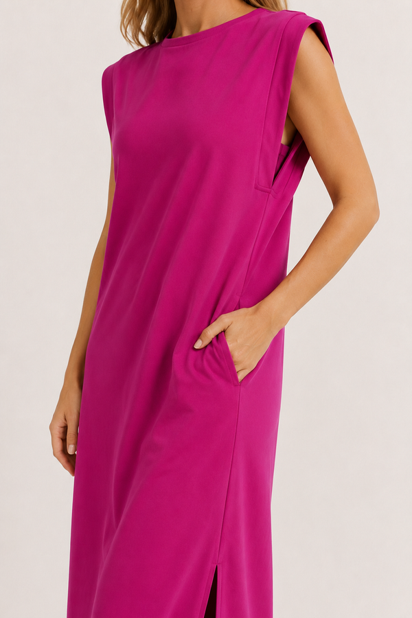 Professional studio shot of a model wearing the Lohnr Rowan Midi dress in Eros Pink, featuring a premium relaxed drape and side split hem.