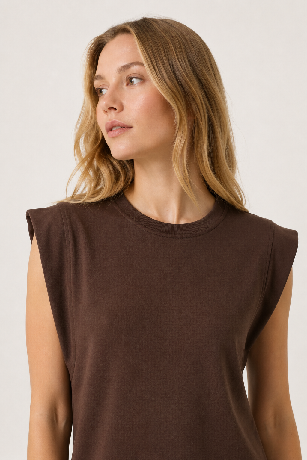 Professional studio shot of a model wearing the Lohnr Rowan Midi dress in Espresso, featuring a premium relaxed drape and side split hem.