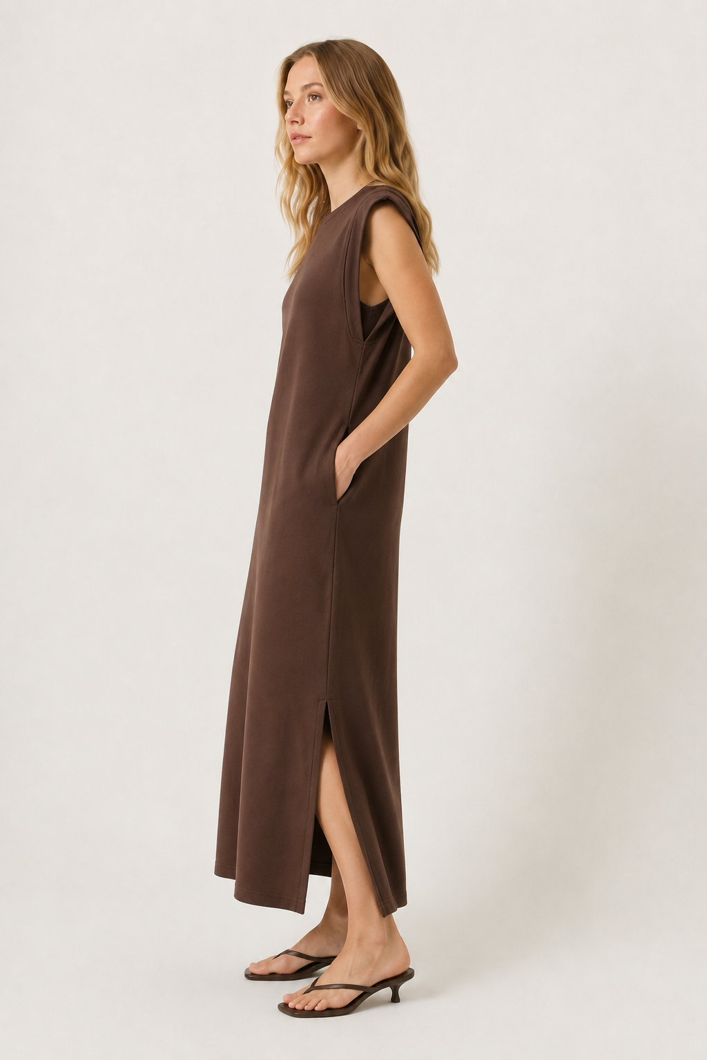 Professional studio shot of a model wearing the Lohnr Rowan Midi dress in Espresso, featuring a premium relaxed drape and side split hem.