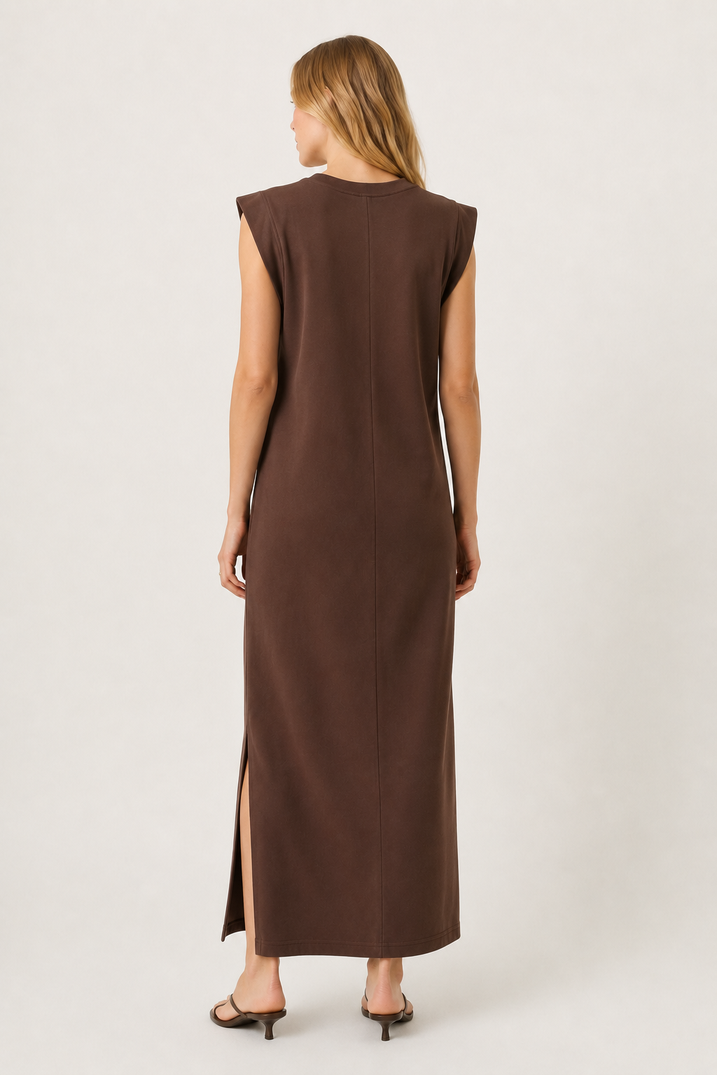 Professional studio shot of a model wearing the Lohnr Rowan Midi dress in Espresso, featuring a premium relaxed drape and side split hem.