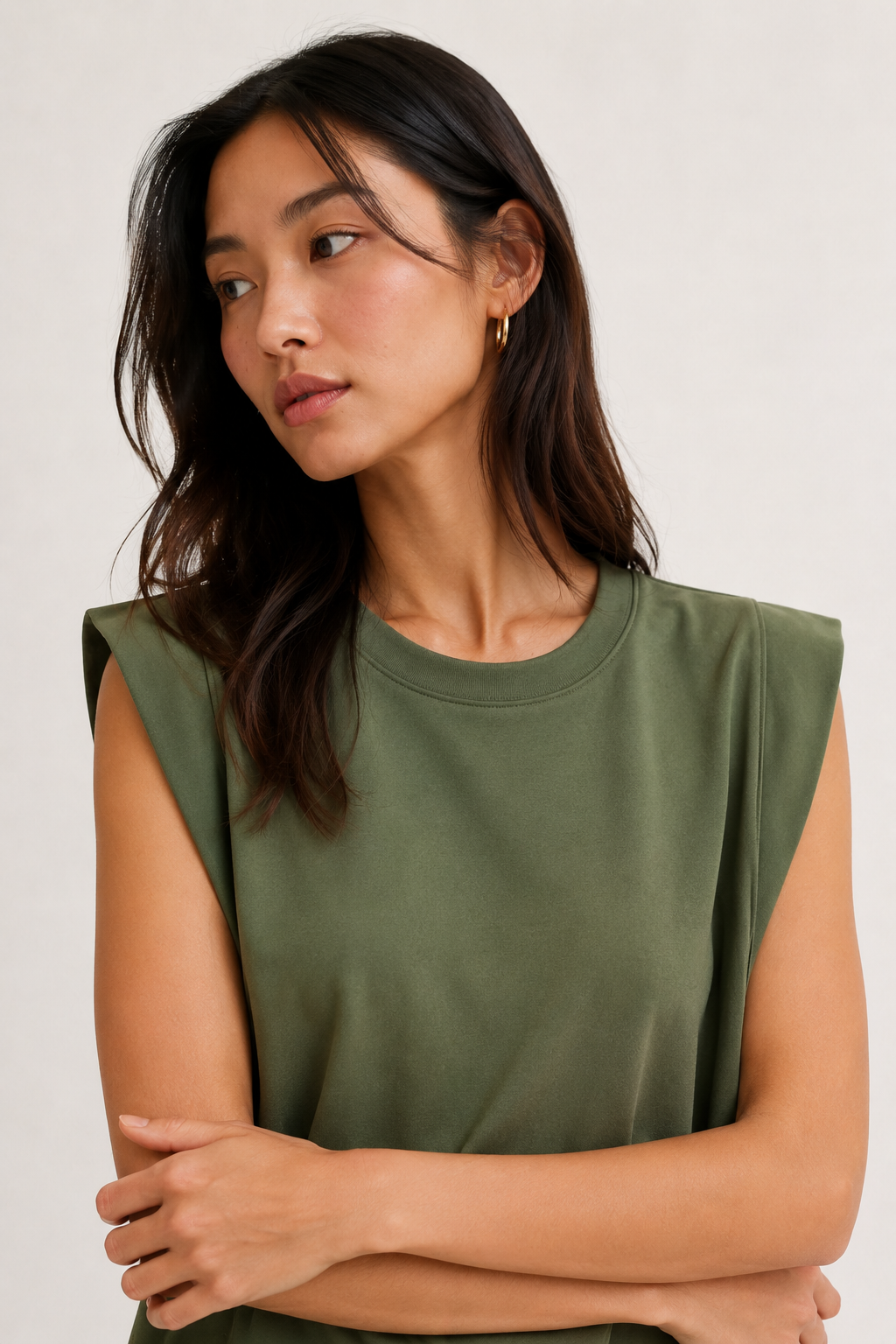 Professional studio shot of a model wearing the Lohnr Rowan Midi dress in Fatigue, featuring a premium relaxed drape and side split hem.