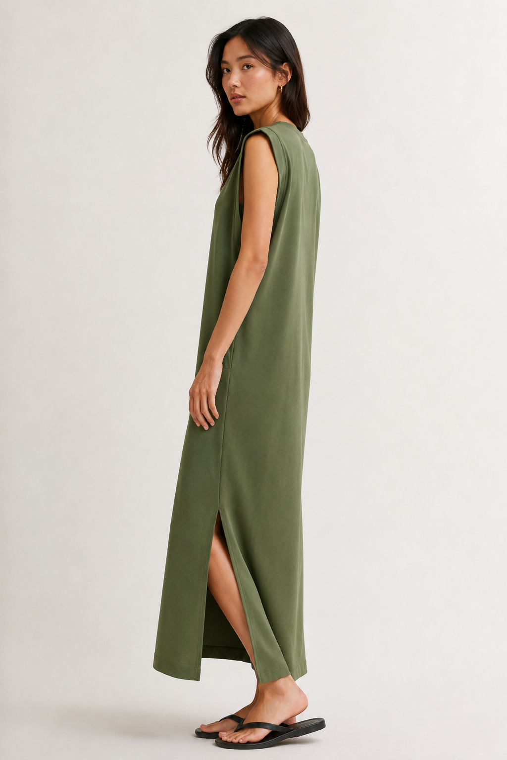 Professional studio shot of a model wearing the Lohnr Rowan Midi dress in Fatigue, featuring a premium relaxed drape and side split hem.