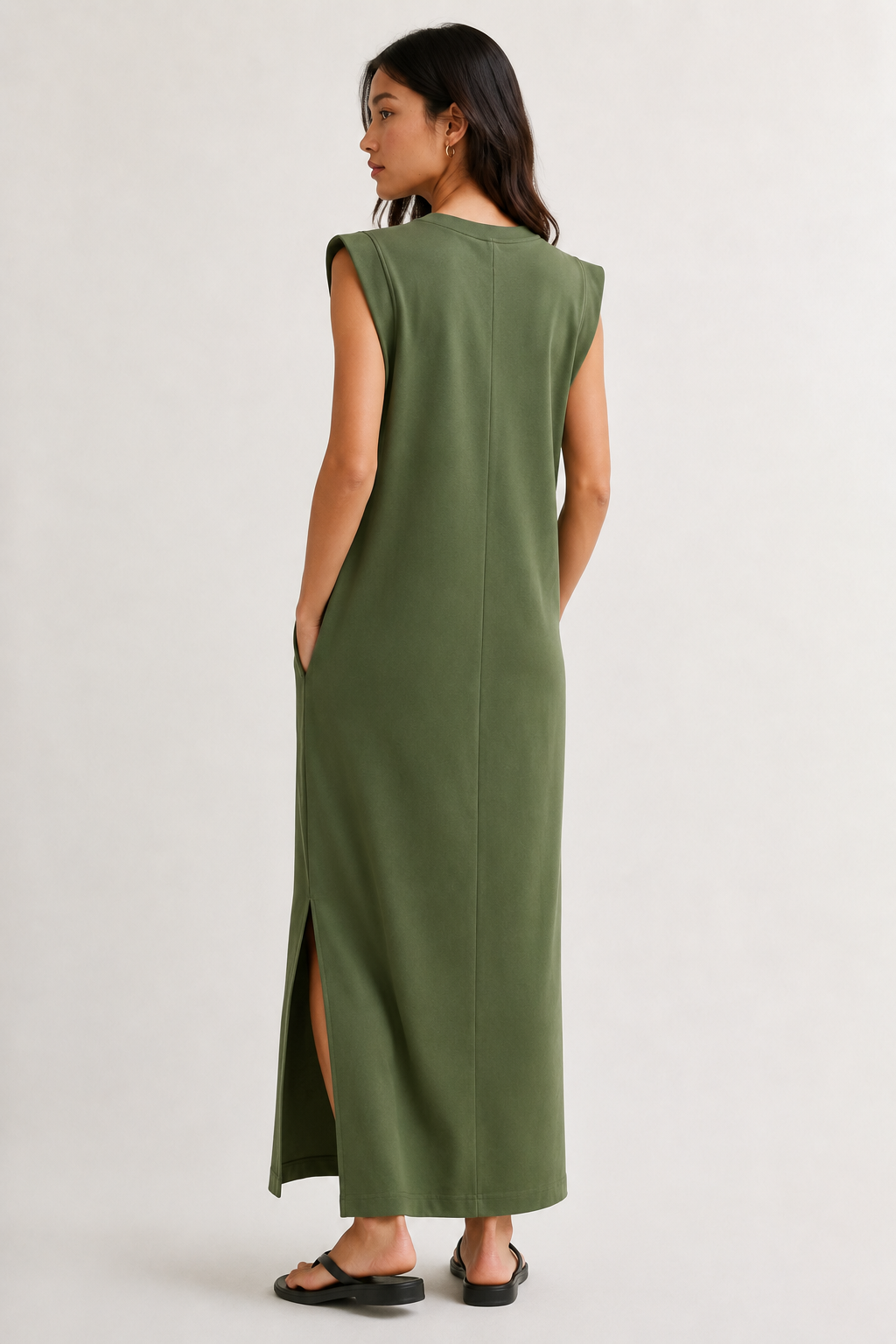 Professional studio shot of a model wearing the Lohnr Rowan Midi dress in Fatigue, featuring a premium relaxed drape and side split hem.