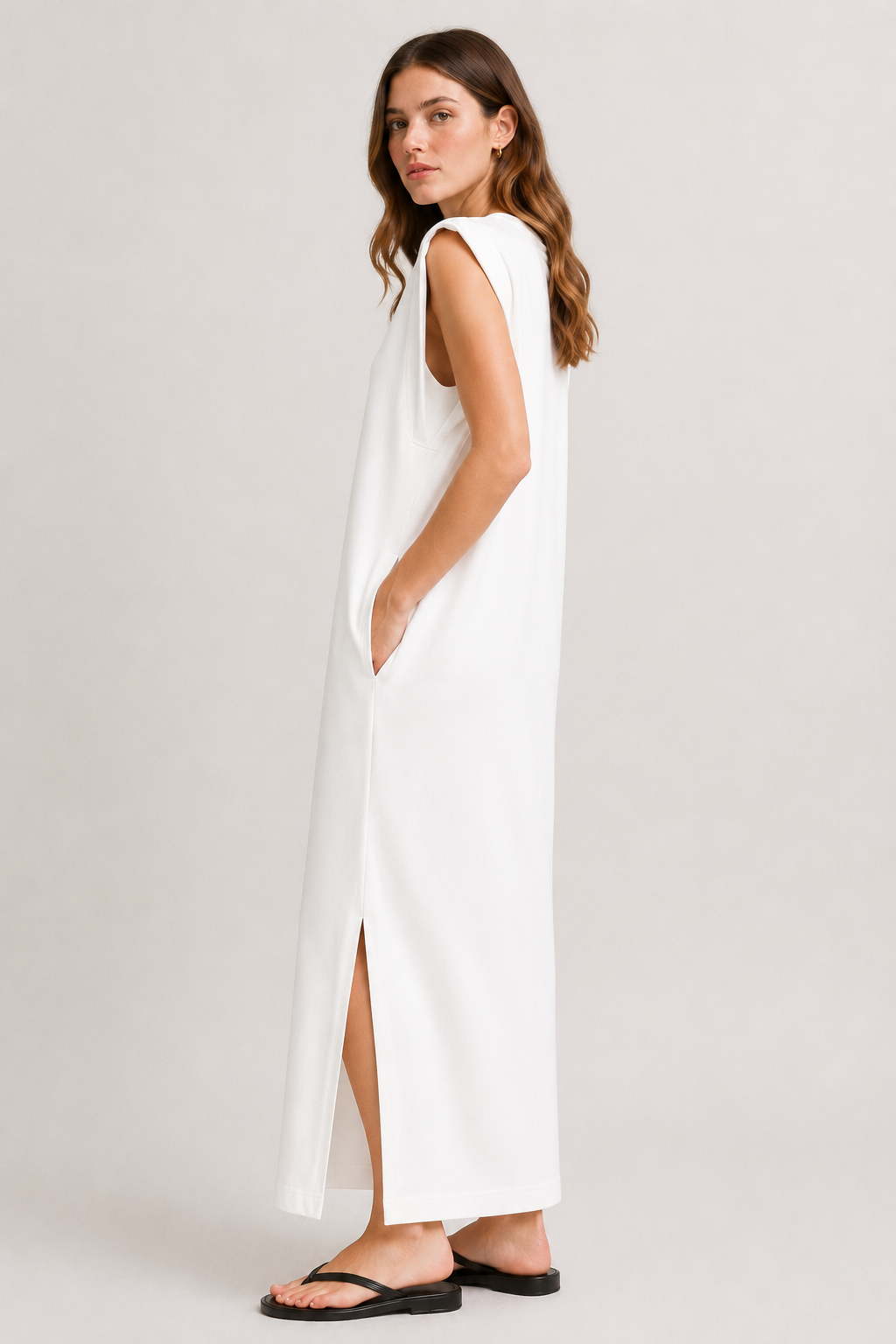 Professional studio shot of a model wearing the Lohnr Rowan Midi dress in Matte Pearl, featuring a premium relaxed drape and side split hem.