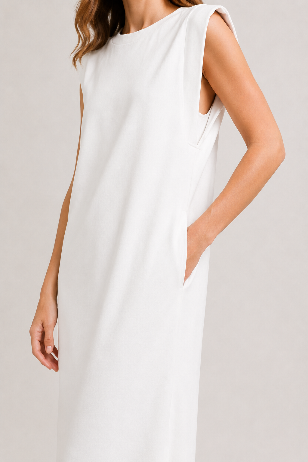 Professional studio shot of a model wearing the Lohnr Rowan Midi dress in Matte Pearl, featuring a premium relaxed drape and side split hem.