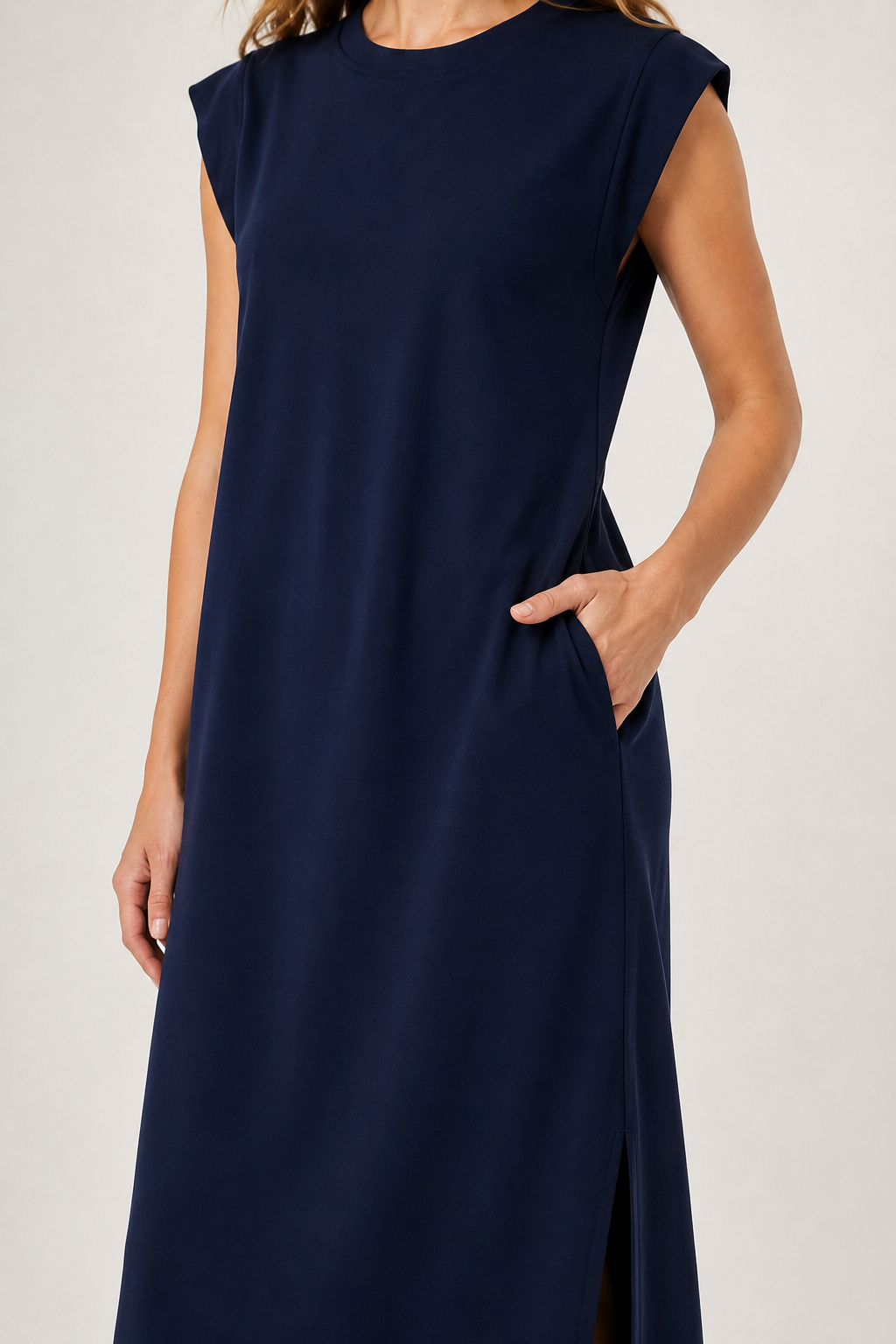 Professional studio shot of a model wearing the Lohnr Rowan Midi dress in Midnight Ink, featuring a premium relaxed drape and side split hem.