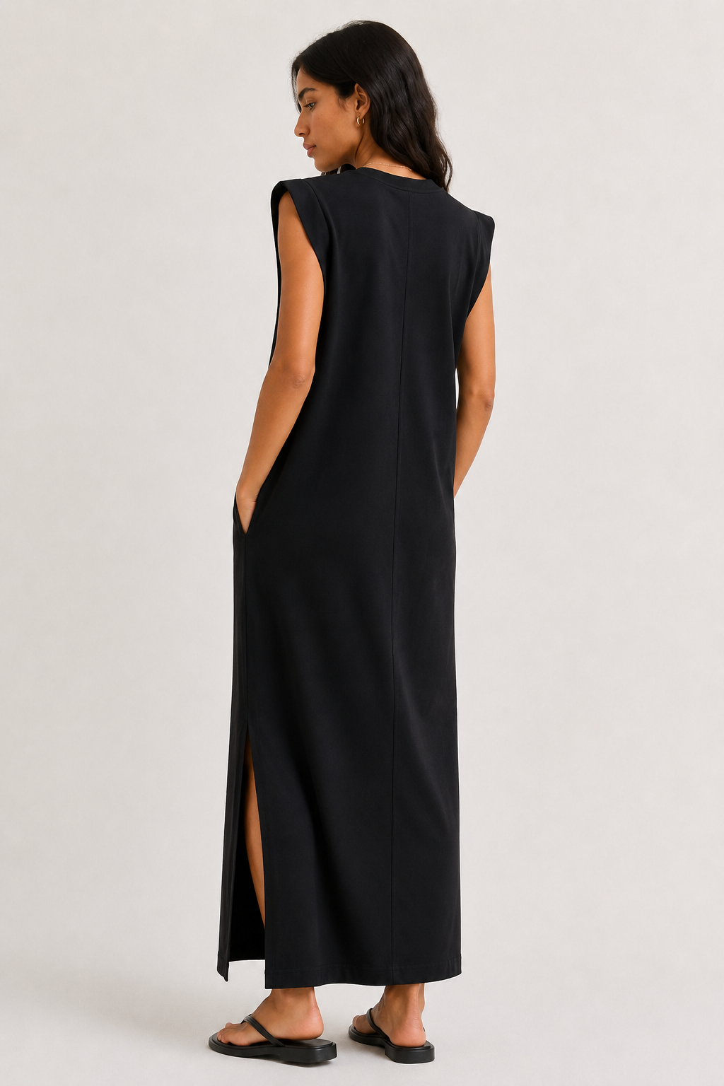 Professional studio shot of a model wearing the Lohnr Rowan Midi dress in Onyx, featuring a premium relaxed drape and side split hem.