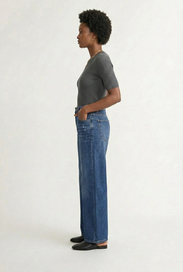 LOHNR Rowe Relaxed Jean. A structured, mid-to-high rise straight-leg denim pant featuring subtle distressed detailing and a classic five-pocket design.