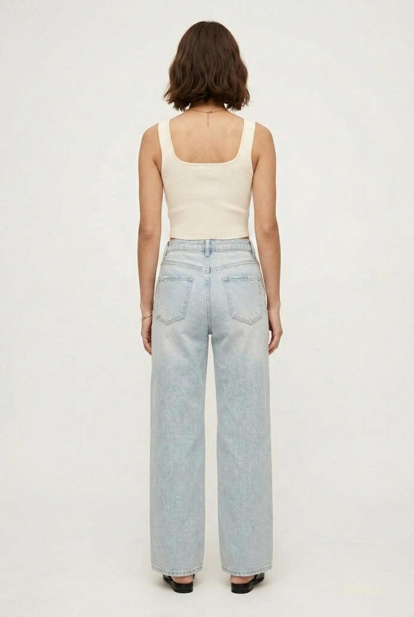 LOHNR Rowe Relaxed Jean. A structured, mid-to-high rise straight-leg denim pant featuring subtle distressed detailing and a classic five-pocket design.