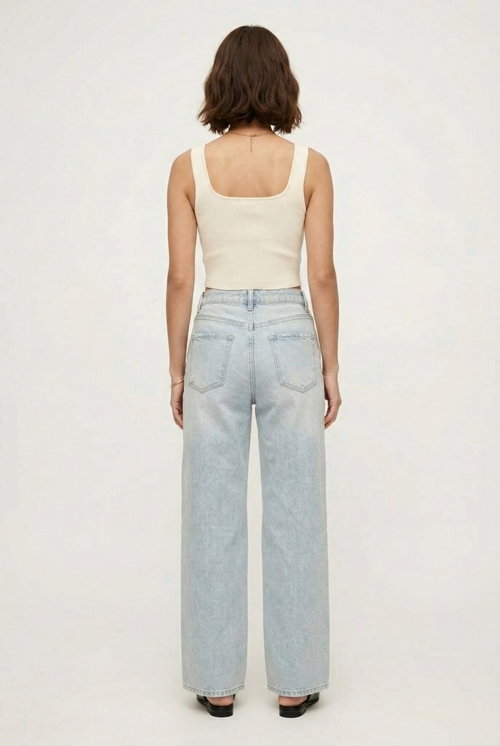 LOHNR Rowe Relaxed Jean. A structured, mid-to-high rise straight-leg denim pant featuring subtle distressed detailing and a classic five-pocket design.