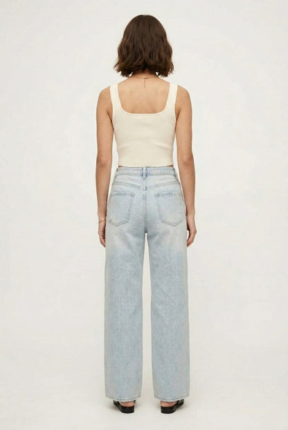 LOHNR Rowe Relaxed Jean. A structured, mid-to-high rise straight-leg denim pant featuring subtle distressed detailing and a classic five-pocket design.