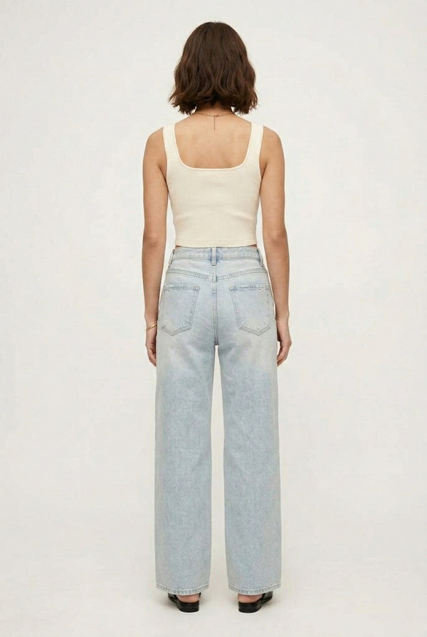 LOHNR Rowe Relaxed Jean. A structured, mid-to-high rise straight-leg denim pant featuring subtle distressed detailing and a classic five-pocket design.