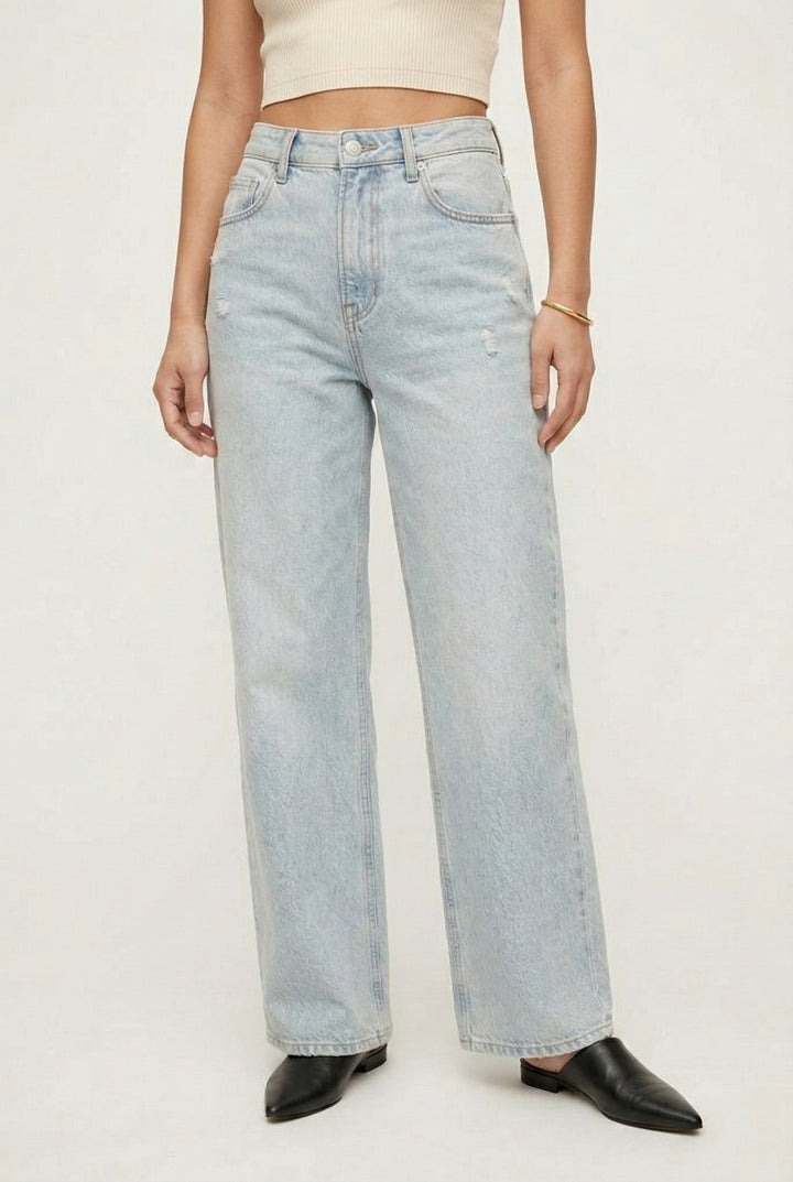 LOHNR Rowe Relaxed Jean. A structured, mid-to-high rise straight-leg denim pant featuring subtle distressed detailing and a classic five-pocket design.