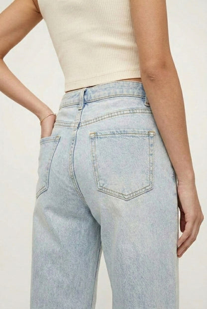 LOHNR Rowe Relaxed Jean. A structured, mid-to-high rise straight-leg denim pant featuring subtle distressed detailing and a classic five-pocket design.