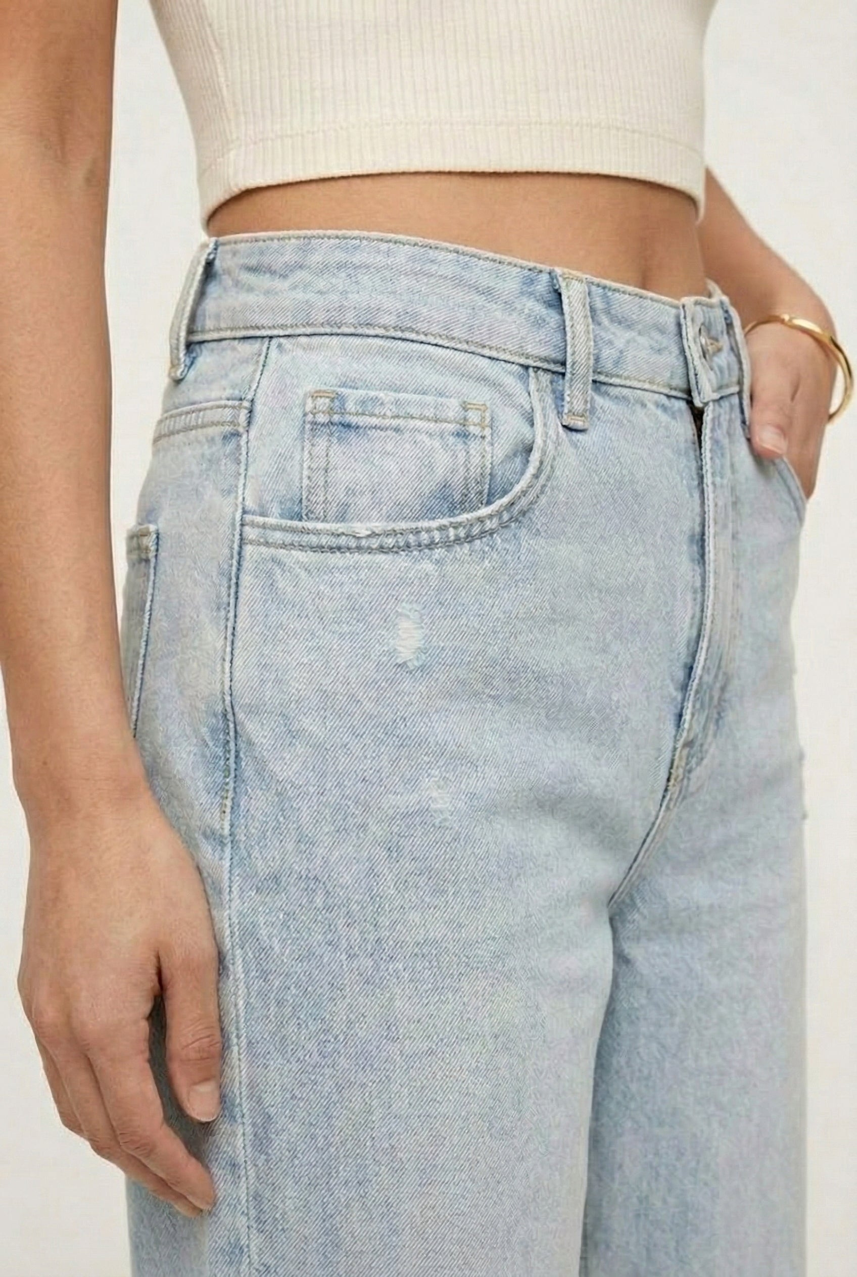 LOHNR Rowe Relaxed Jean. A structured, mid-to-high rise straight-leg denim pant featuring subtle distressed detailing and a classic five-pocket design.