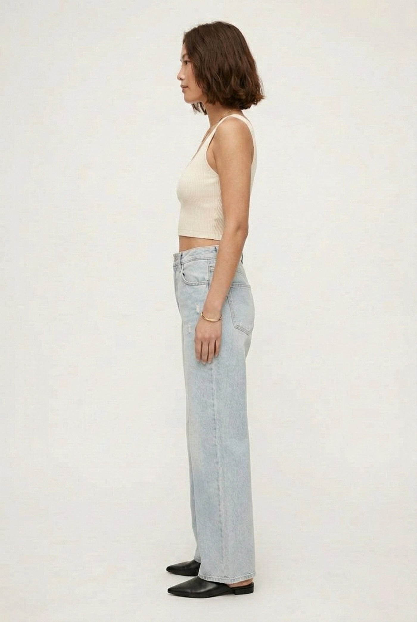 LOHNR Rowe Relaxed Jean. A structured, mid-to-high rise straight-leg denim pant featuring subtle distressed detailing and a classic five-pocket design.