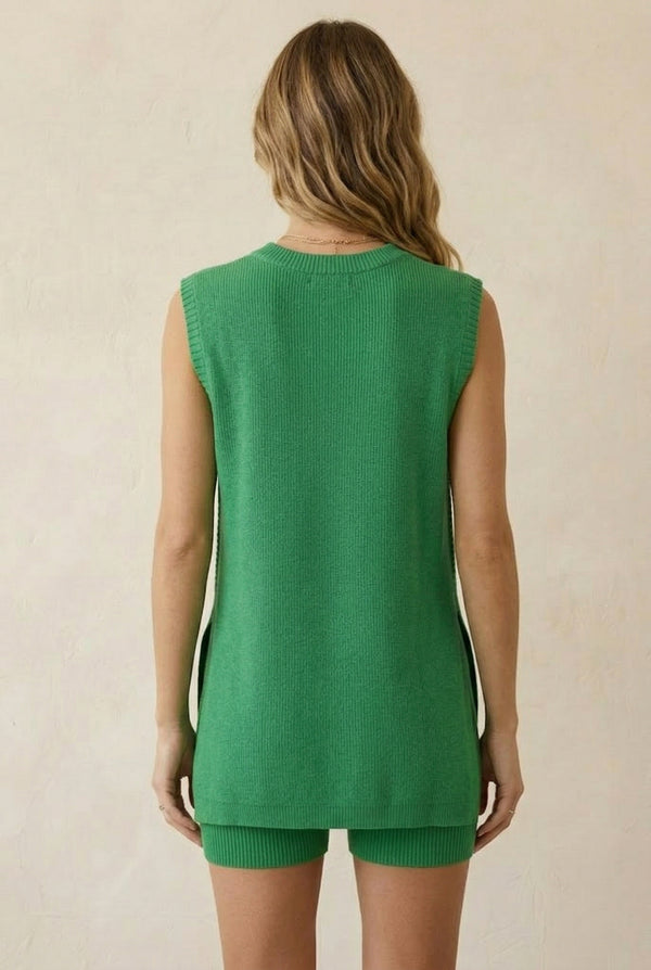 A woman wearing the LOHNR Slouch Tunic Set in Clover green, featuring a sleeveless knit top and matching shorts.