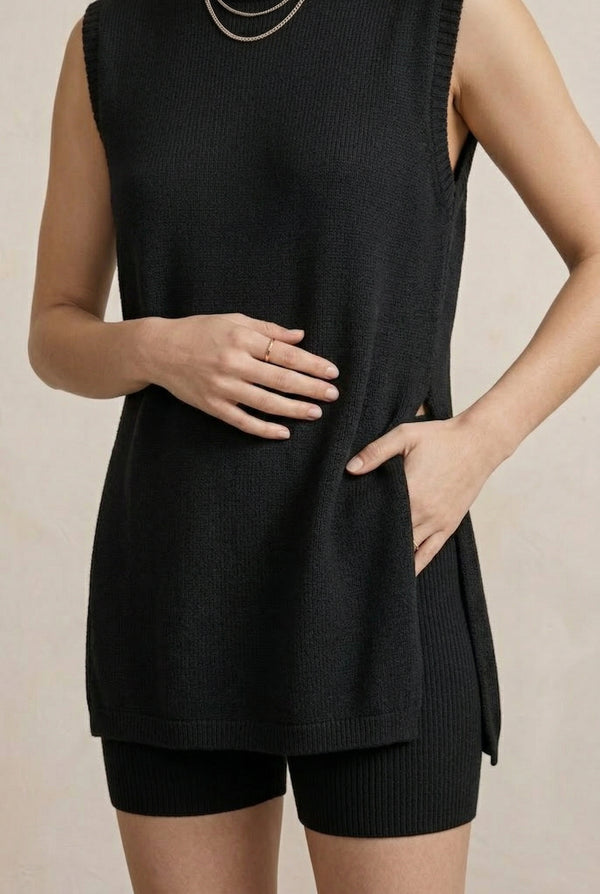 A woman wearing the LOHNR Slouch Tunic Set in Onyx black, a premium sleeveless loungewear set with a relaxed fit.