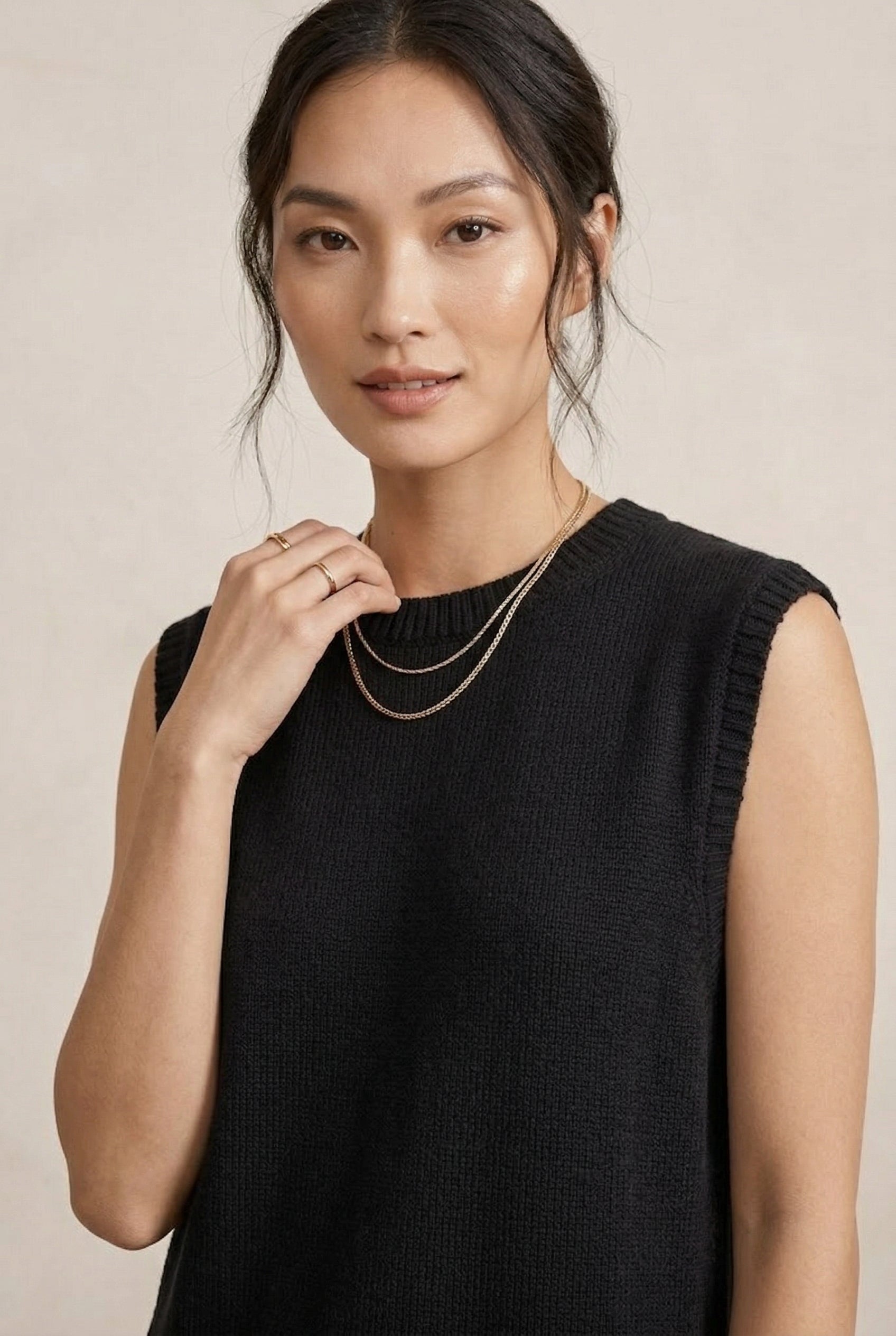 A woman wearing the LOHNR Slouch Tunic Set in Onyx black, a premium sleeveless loungewear set with a relaxed fit.